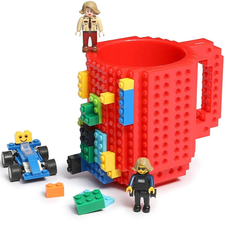 Red mug with building block design, surrounded by colorful building blocks and figures on a white background