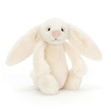 Cream bunny plush toy on a white background