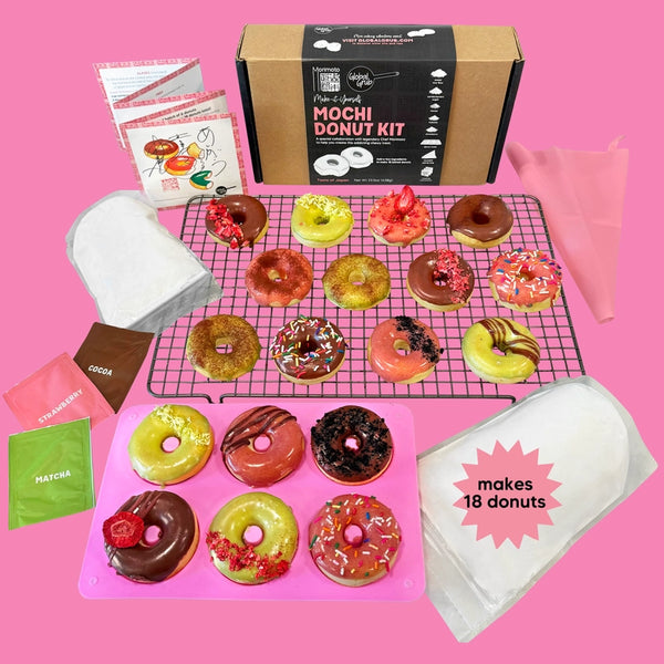Mochi donut kit with various colored donuts on a pink background
