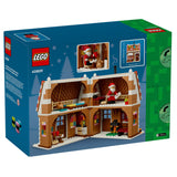 LEGO 40809 Christmas Cottage building set box, showing the assembled brown and white cottage with Santa minifigure visible in the window photos on the packaging.