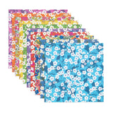 Set of colorful floral-patterned paper sheets on a white background