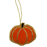 Pumpkin-shaped ornament with gold accents on a white background