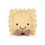 Plush toy ravioli with a smiling face on a white background