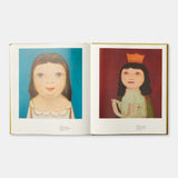 Open book showing two illustrations of children on a white background