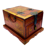 A vintage Chinese painted wooden jewelry box with a drawer and a foldable mirror. The box is open, displaying its interior and the exterior's detailed gold-painted designs of birds, fruits, and flowers.